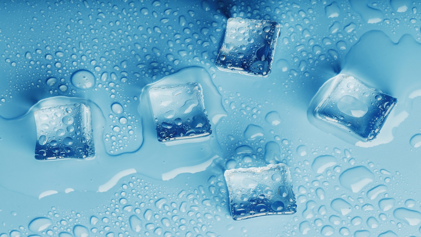 Ice cubes with drops of melt water water on a blue background, top view. Freshness in the sultry heat. Cooling drinks