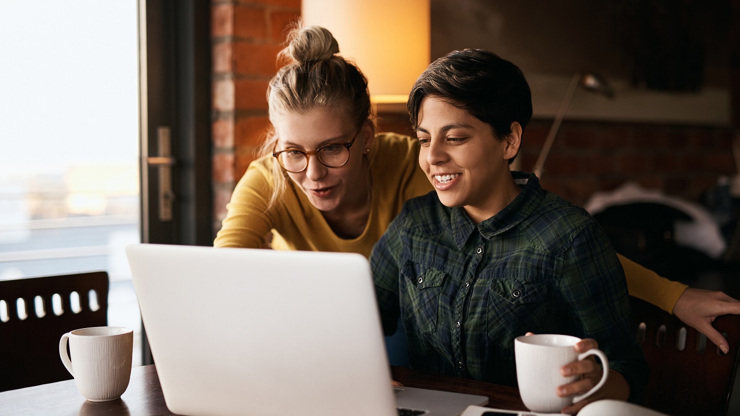 Cropped shot of a young couple using wireless technology at home